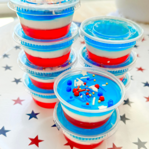4th of july jello shots | 4th of july themed jello shots | coconut rum jello shots | DIY | easy recipe | fromunderapalmtree | how to make the white layer in red white and blue jello shots | jello shots jello | jello shots recipe | jello shots with cool whip | jello shots with rum | jello shots with vodka | lifestyle blog | mom blogger | non alcoholic jello shots | non alcoholic red white and blue jello shots | party | party foods | red white and blue jello shots | red white and blue jello shots recipe | red white and blue jello shots with cream cheese | red white and blue jello shots with malibu | red white and blue jello shots with vodka | white jello shots with condensed milk | adult drinks | adult shots | red white and blue jello | red white and blue jello dessert | red white and blue jello cups | red white and blue jello poke cake | red white and blue jello salad | red white and blue jello cake | red white and blue jello shots alcohol | red white and blue jello jigglers | red white and blue jello mold |